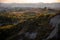 Beautiful idyllic sunny late summer landscape of Toscana with hills, trees, fields and forests. Evening or morning in Italy.