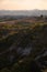 Beautiful idyllic sunny late summer landscape of Toscana with hills, trees, fields and forests. Evening or morning in Italy.