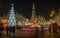 Beautiful illuminated Christmas tree and mooving carousel at Wroclaw city center. Long exposure photo