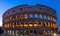 Beautiful illumination of Colloseum at sunrise. No people at Colloseum amphitheatre. Rome travel destination