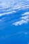 Beautiful image above the white clouds. Blue sky and white clouds taken from aeroplane. Nature sky background concept.