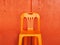 The beautiful image of the clean orange  urban vintage plastic chair