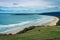 Beautiful image from Florence Hill lockout of a long beach at low tide taken on a cloudy winter day, New Zealand