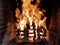 Beautiful image of moving fire in a bonfire made with wooden planks in grid in brick fireplace