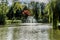 Beautiful image of a pond with a fountain with reflection in the water