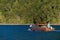 Beautiful image of wooden fishing boat navigating. Taken at lake Todos los Santos in Vicente Perez Rosales national park at