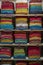 Beautiful Indian coloured cloth fabric folded on shelves for sale, India