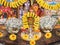 Beautiful Indian Puja Room with rupee notes arranged in a plate, gods photo and kalash decorated with flowers