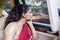 Beautiful Indian woman looks pensive in a car