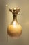 Beautiful indigenous poporo vase with golden top and a wooden stick