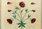 Beautiful inlaid decorative flowers on white marble column of Red Fort in Delhi