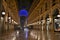 Beautiful inside panoramic view to the Vittorio Emanuele II Gallery with giant blue crest made of Swarovski crystals and cafes.