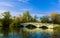 Beautiful inviting view of old vintage retro style bridge at Toronto center island with people walking