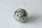 Beautiful iron ball from natural pyrite. On a white background. Golden and golden ball or pyrite sphere. Natural stones.