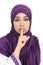 Beautiful islamic woman wearing a hijab asking for silence