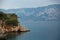 Beautiful islands of the Aegean Sea with pine forest, rocks, deep blue water and mountains in the background. Marmaris