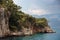 Beautiful islands of the Aegean Sea with pine forest, rocks, deep blue water and mountains in the background. Marmaris