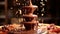 A beautiful Italian chocolate fountain flowing with cascades of glossy melted chocolate