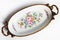 Beautiful Italian porcelain dish decorated with with flowers and gold isolated on white background.