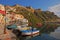 Beautiful Italian seaside view of Procida, Napoli with many small colorful wooden boats docked