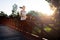 Beautiful jogger crossing bridge