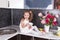 Beautiful joyful girl and kitchen close-up. Kitchen furniture