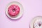 Beautiful juicy donut with a sweet cream.Cupcake on pink background for kitchen design
