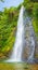 Beautiful Kaeng Nyui Waterfalls. Laos landscape. Vertical panorama