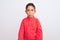 Beautiful kid boy wearing elegant red shirt standing over isolated white background depressed and worry for distress, crying angry