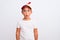 Beautiful kid boy wearing fanny colorful cap with propeller over isolated white background afraid and shocked with surprise