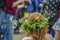 Beautiful kid enjoying swedish traditional mid summerday in a  cloudy day with colourful flower crown