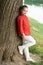 Beautiful kid. Small cute kid with beauty look on natural landscape. Adorable kid with long blond hair in casual style