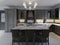 Beautiful kitchen in luxury home with island, pendant lights, cabinets, and self-leveling floors. marble backsplash, elegant