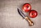 Beautiful knife with wooden handle and two ripe pomegranates. Hand knife and grenades.