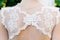 Beautiful lace on the bride\'s dress.