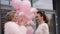 Beautiful ladies in pink and white clothes ready for party.