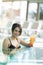 Beautiful lady drinking a cocktail in a swimming pool and relaxi