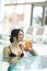 Beautiful lady drinking a cocktail in a swimming pool and relaxi