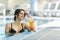 Beautiful lady drinking a cocktail in a swimming pool and relaxi