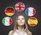 Beautiful lady is surrounded by bubbles with european countries\' flags (Italian, German, Great Britain, French, Spanish). Learning