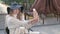 Beautiful lady takes a selfie with a smartphone posing in an outdoor cafe