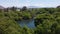 Beautiful Lago de Camecuaro lake surrounded by lush greenery in Michoacan