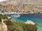 Beautiful lagoon with small passenger ferry and clear transparent water at southern part of Crete island, Greece