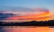 Beautiful lake with colorful sunset sky. Tranquil vibrant landscape
