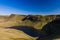 A beautiful lake at the foot of steep-sided mountains Llyn y Fan Fach, Brecon Beacons, Wales