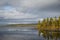 A beautiful lake landscape in Femundsmarka National Park in Norway. Lake with a distant mountains in background.