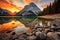 Beautiful Lake Louise, Banff National Park, Alberta, Canada, Sunrise reflects on an orange mountain at Lake Minnewanka in Banff