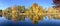 Beautiful lake reflections of New England foliage, panoramic vie