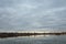 Beautiful lake and sky landscape with reeds and clouds, natural background