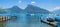 Beautiful lake Thunersee with boardwalk and boats, view to Niederhorn mountain, switzerland